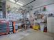 A clean organized garage space, complete with a workbench and ample storage for tools and supplies at 33409 Pennbrooke Pkwy, Leesburg, FL 34748