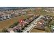 Home in a residential neighborhood with houses and green surroundings at 412 Arbor Pointe Ave, Minneola, FL 34715