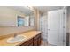 Standard bathroom featuring neutral finishes and a shower with a patterned curtain at 412 Arbor Pointe Ave, Minneola, FL 34715