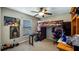 Unique bedroom with a lofted bed, fun decor, a comfortable chair, and bright natural light from the window at 412 Arbor Pointe Ave, Minneola, FL 34715