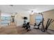 Spacious bonus room features fitness equipment and a view of the hallway at 412 Arbor Pointe Ave, Minneola, FL 34715