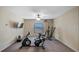 Large bonus room featuring neutral colors, a ceiling fan, and fitness equipment at 412 Arbor Pointe Ave, Minneola, FL 34715