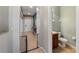 Welcoming entryway featuring neutral tones and a clear view into a cozy powder room for guests at 412 Arbor Pointe Ave, Minneola, FL 34715