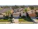 Charming home featuring a manicured front yard and an attached two-car garage at 412 Arbor Pointe Ave, Minneola, FL 34715