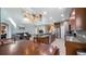 Open floor plan with a kitchen island, stainless appliances, and a view into the living room at 412 Arbor Pointe Ave, Minneola, FL 34715