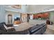 Spacious living room and kitchen with stainless appliances, island, and staircase at 412 Arbor Pointe Ave, Minneola, FL 34715