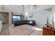 Living area with high ceilings, large windows, and an open layout to the kitchen at 412 Arbor Pointe Ave, Minneola, FL 34715
