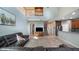 Bright living room with soaring ceilings and a view into the kitchen and staircase at 412 Arbor Pointe Ave, Minneola, FL 34715