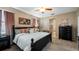 Spacious main bedroom with ensuite bathroom and decorative wall art at 412 Arbor Pointe Ave, Minneola, FL 34715