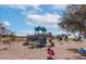 Community playground with slides, climbing structures, and spring riders, creating a fun and safe area at 412 Arbor Pointe Ave, Minneola, FL 34715