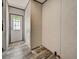 Hallway with a white front door and wood-look flooring at 4500 Spartan Dr, Orlando, FL 32822