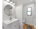 Clean bathroom featuring a modern vanity and toilet in a bright, well-lit space at 4723 Cr 306, Lake Panasoffkee, FL 33538