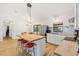 Bright kitchen features a wooden countertop island with red stools and stainless steel appliances at 4723 Cr 306, Lake Panasoffkee, FL 33538