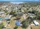 Scenic aerial view of the property near a lake in a serene residential neighborhood at 4918 County Road 114, Wildwood, FL 34785