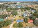 Panoramic aerial view showcasing the home in a peaceful neighborhood with pond views at 4918 County Road 114, Wildwood, FL 34785