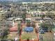 Expansive aerial view of the property in a residential neighborhood with mature trees at 4918 County Road 114, Wildwood, FL 34785