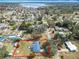 Aerial view of the property in a residential neighborhood with mature trees and clearly defined property lines at 4918 County Road 114, Wildwood, FL 34785