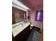 Bathroom with floral wallpaper, marble vanity, and step in bathtub at 5 Magnolia Ln, Yalaha, FL 34797