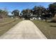 Community boat ramp providing easy access to the lake, surrounded by lush landscaping and clear blue skies at 5 Magnolia Ln, Yalaha, FL 34797