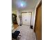 Bright foyer with tiled floor and double entry doors at 5 Magnolia Ln, Yalaha, FL 34797