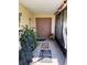 Inviting front porch with double doors, plants, and decorative touches at 5 Magnolia Ln, Yalaha, FL 34797