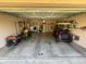 Spacious two-car garage featuring ample storage, laundry area, and convenient access to tools and equipment at 5 Magnolia Ln, Yalaha, FL 34797