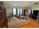 Relaxing living room featuring laminate floors, neutral walls, and comfortable seating at 5 Magnolia Ln, Yalaha, FL 34797