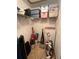 A closet with storage shelves containing household items and cleaning supplies at 5 Magnolia Ln, Yalaha, FL 34797