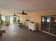 Bright sun room with tile floors and large windows, offering a relaxing and airy space with stylish furniture at 5 Magnolia Ln, Yalaha, FL 34797