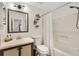 Bathroom with a vanity, a shower-tub combo, and plant decor at 520 Saint Andrews Blvd, The Villages, FL 32159