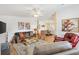 Open concept living room leading into the dining area, with comfortable seating and natural light at 520 Saint Andrews Blvd, The Villages, FL 32159
