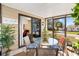 Covered patio with outdoor seating, plants, and a view of the street at 520 Saint Andrews Blvd, The Villages, FL 32159