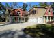 Charming two-story home with a three-car garage and large driveway at 600 Urick St, Fruitland Park, FL 34731