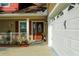 Close up of the front entrance, showcasing the door, porch, and landscaping at 600 Urick St, Fruitland Park, FL 34731