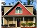 Lovely front exterior featuring a stained wood door and manicured landscaping at 600 Urick St, Fruitland Park, FL 34731