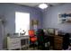 A home office provides a bright workspace with lots of room for a desk and computer at 600 Urick St, Fruitland Park, FL 34731