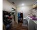 A laundry room with washer, dryer, sink, shoe rack and closet for storage at 600 Urick St, Fruitland Park, FL 34731