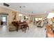 Living room with piano, tile floors, and an open floor plan at 6025 Dijulio Ter, The Villages, FL 32163