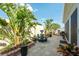 Charming patio showcasing mature landscaping, a decorative water feature, and neutral pavers at 6025 Dijulio Ter, The Villages, FL 32163