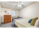 Comfortable bedroom with a ceiling fan, neutral paint, and carpet flooring at 705 Cortez Ave, The Villages, FL 32159