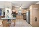 Well-equipped kitchen with stainless steel appliances, breakfast bar, and tile flooring at 705 Cortez Ave, The Villages, FL 32159