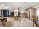 Bright, open concept living area with a kitchen, dining area, and cozy living space at 705 Cortez Ave, The Villages, FL 32159