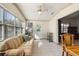 Sun room with tile flooring, a comfortable couch, and lots of natural light at 705 Cortez Ave, The Villages, FL 32159