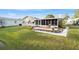 Spacious backyard and large enclosed lanai with lovely patio and landscaping at 736 Heathrow Ave, The Villages, FL 32159