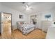 Bedroom showcasing bright, natural light, a ceiling fan, and a comfortable bed at 736 Heathrow Ave, The Villages, FL 32159