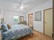 Comfortable bedroom with a ceiling fan, window, and a serene decor create a tranquil retreat at 736 Heathrow Ave, The Villages, FL 32159