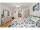Primary bedroom featuring a light-filled space, skylight, and well-appointed decor at 736 Heathrow Ave, The Villages, FL 32159