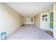 Covered breezeway, with access to the front door, offers versatile space at 736 Heathrow Ave, The Villages, FL 32159