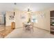 Charming dining area with a round table, four chairs, and light-yellow walls at 736 Heathrow Ave, The Villages, FL 32159
