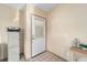 Functional entryway featuring neutral walls and a white tiled floor at 736 Heathrow Ave, The Villages, FL 32159